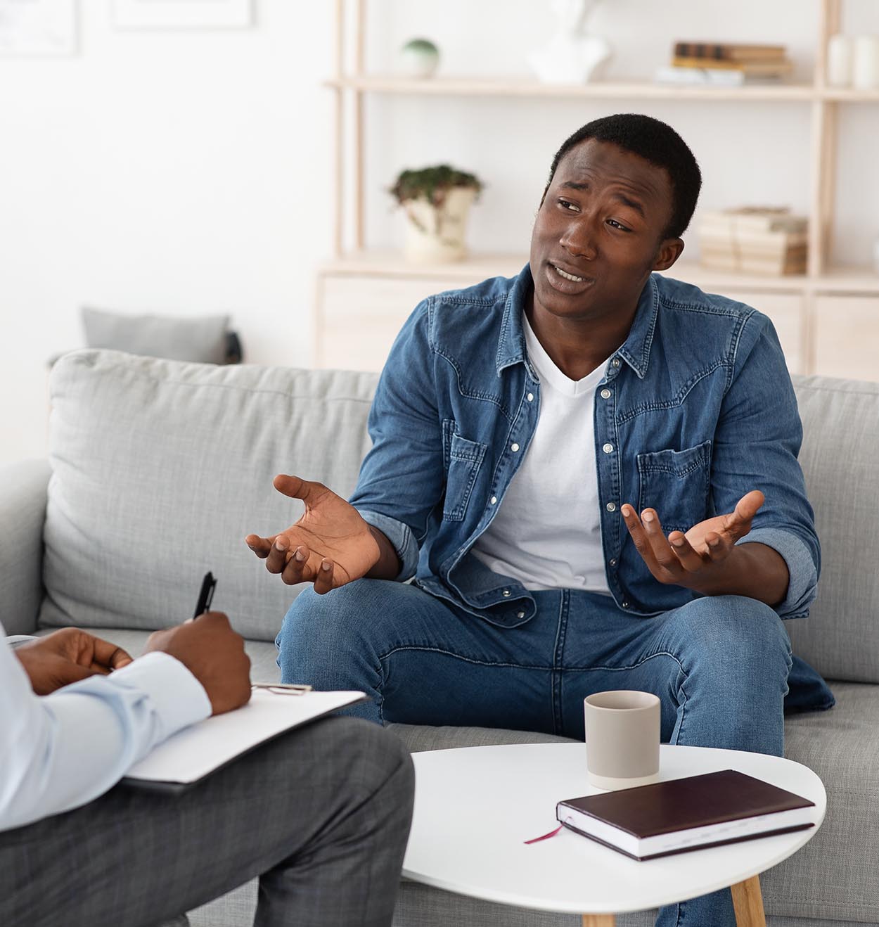 Successful therapy with a black man talking to psychologist