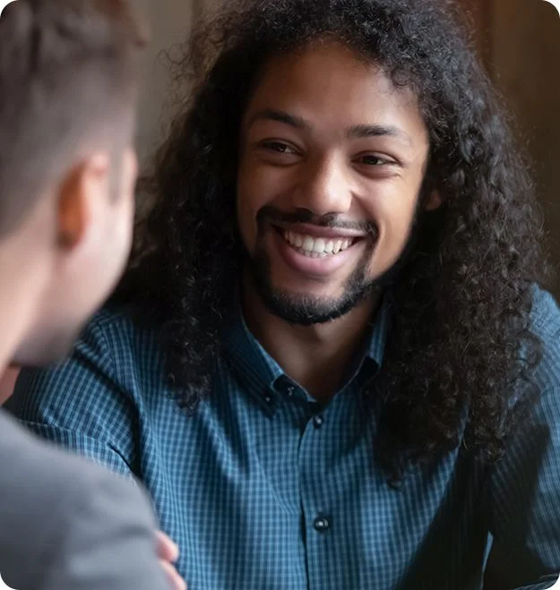 Man expressing happiness during therapy session