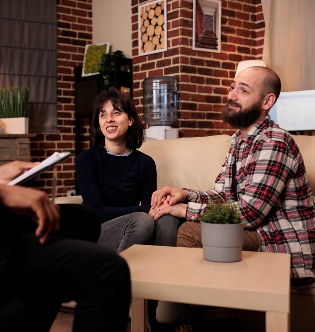 Couple smiling after resolving relationship problems